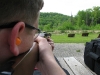 Me looking down Adam\'s 10/22\'s sights